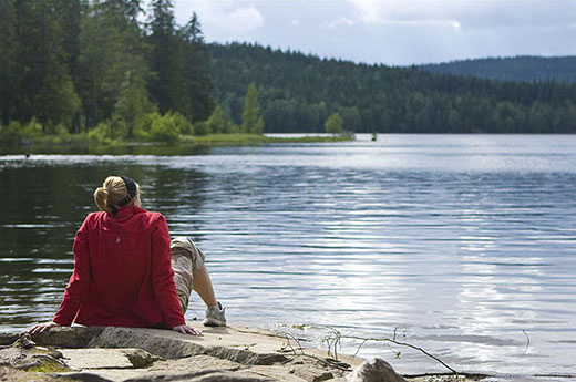 Lonely girl by a lake