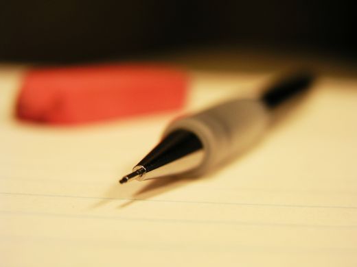 A pencil and an eraser on a pad on my desk